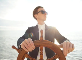 "at the helm of" picture